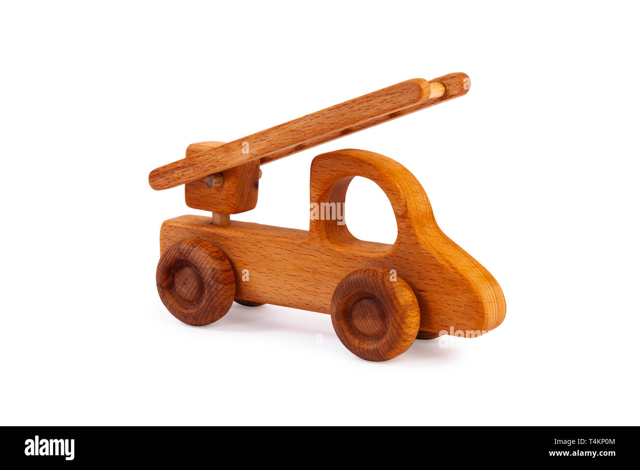 Photo of a wooden car truck made of beech on a white isolated background Stock Photo