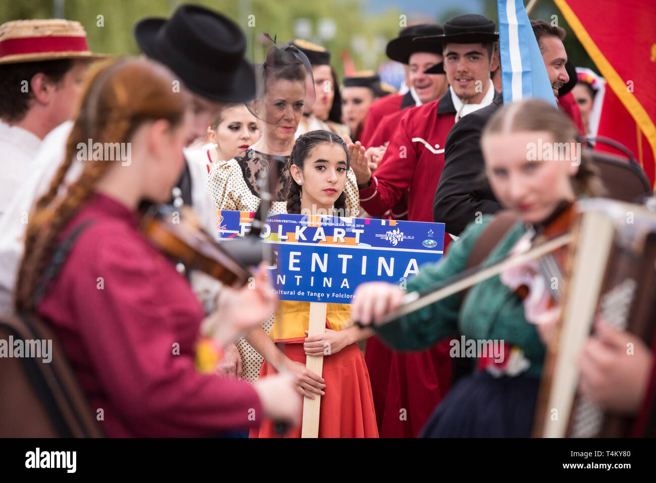 Members of asociación Artístico Cultural de Tango y Folclore Nuestras Raíces from Rosario, Argentina during the procession at 30th Folkart International CIOFF Folklore Festival, folklore sub-festival of Festival Lent, one of the largest outdoor festivals in Europe. Folkart, Festival Lent, Maribor, Slovenia, 2018. Stock Photo