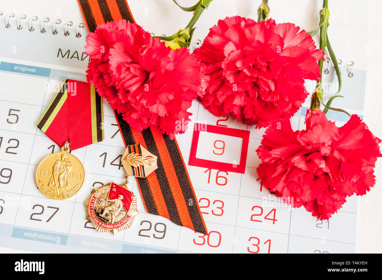 9 May - medals of Great patriotic war with red carnations and George ...