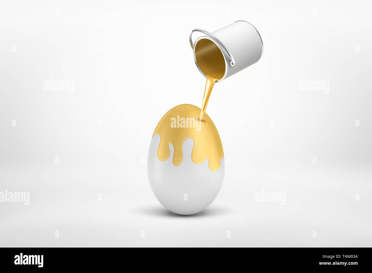 3d rendering of small silver paint bucket turned upside down with golden paint pouring on big white egg isolated on white background Stock Photo