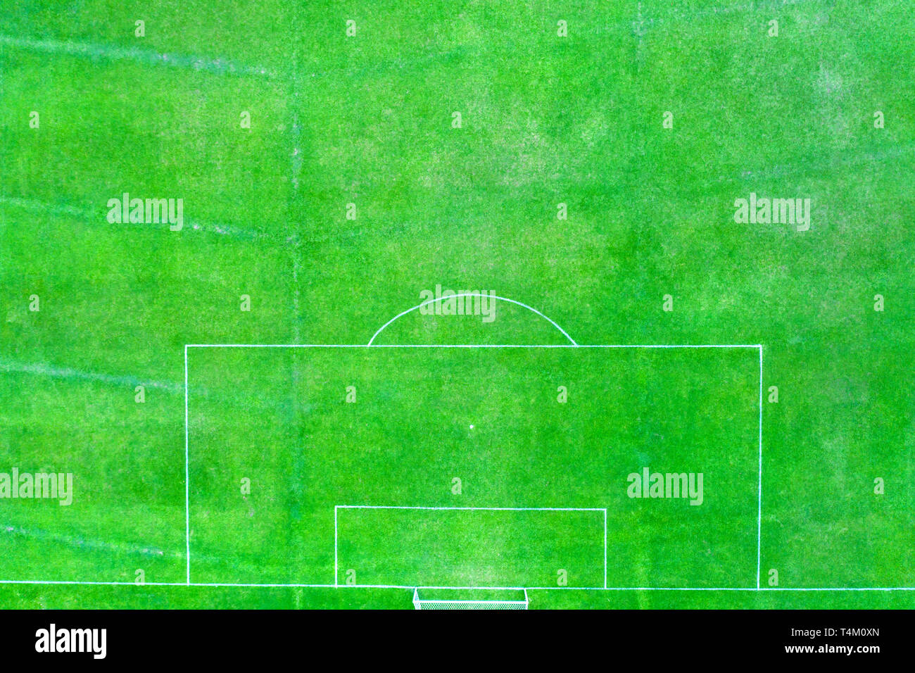 alternative perspective aerial view of a football pitch with penalty area and attached with real green grass. Stock Photo