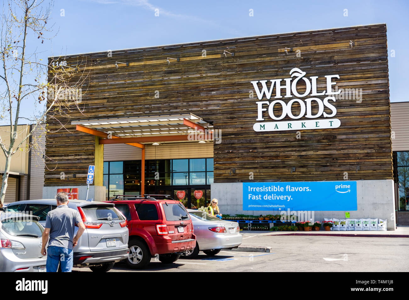 April 14, 2019 San Jose / CA / USA - Whole Foods store displaying an ad for Amazon Prime Membership Stock Photo