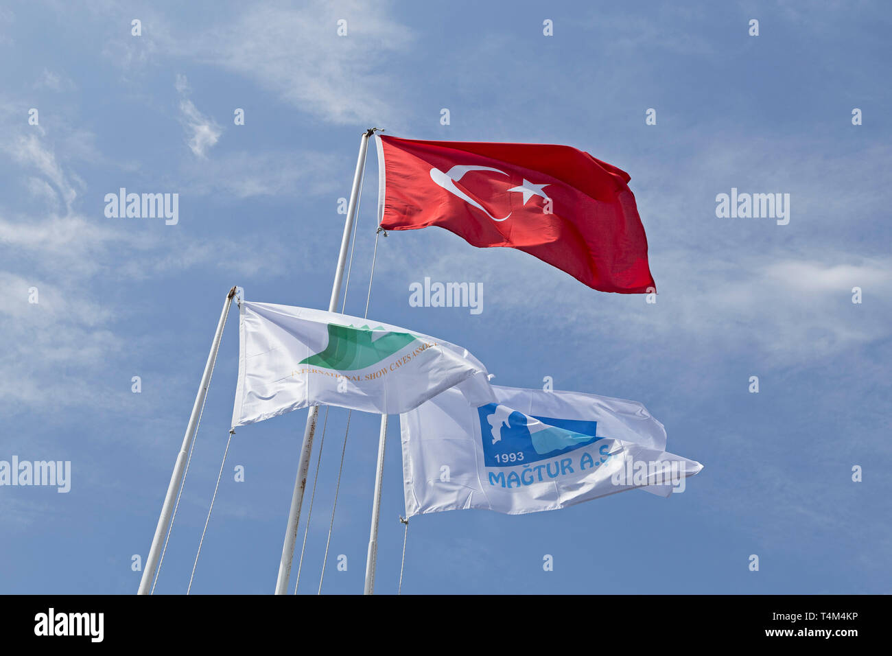 flags near Dim Magarasi Cave, Kestel, Alanya, Province Antalya, Turkey Stock Photo