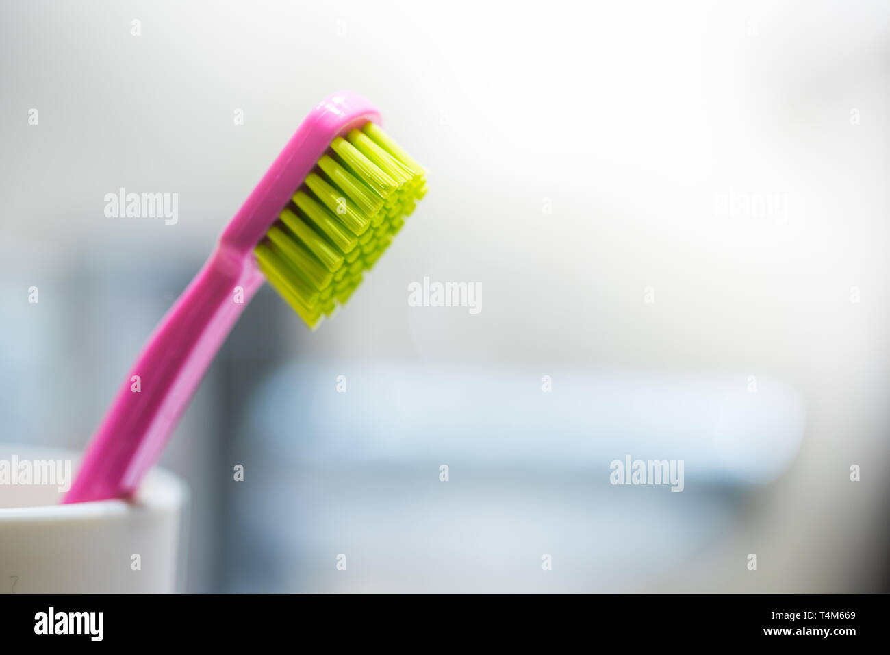 Colorful toothbrush in the bathroom, morning routine Stock Photo - Alamy