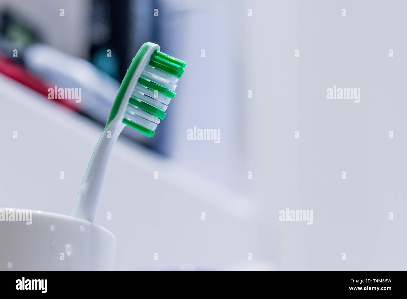 Colorful toothbrush in the bathroom, morning routine Stock Photo - Alamy