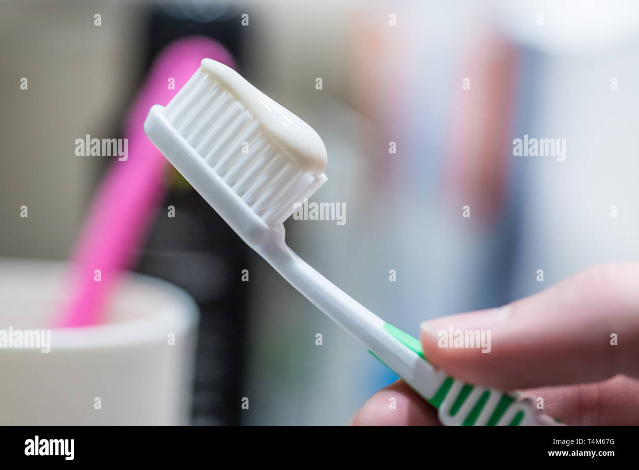Colorful toothbrush in the bathroom, morning routine Stock Photo - Alamy
