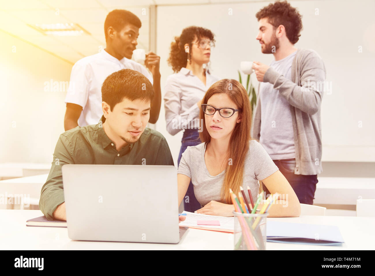 Software developers work as a team with laptop computers in the business office Stock Photo Alamy