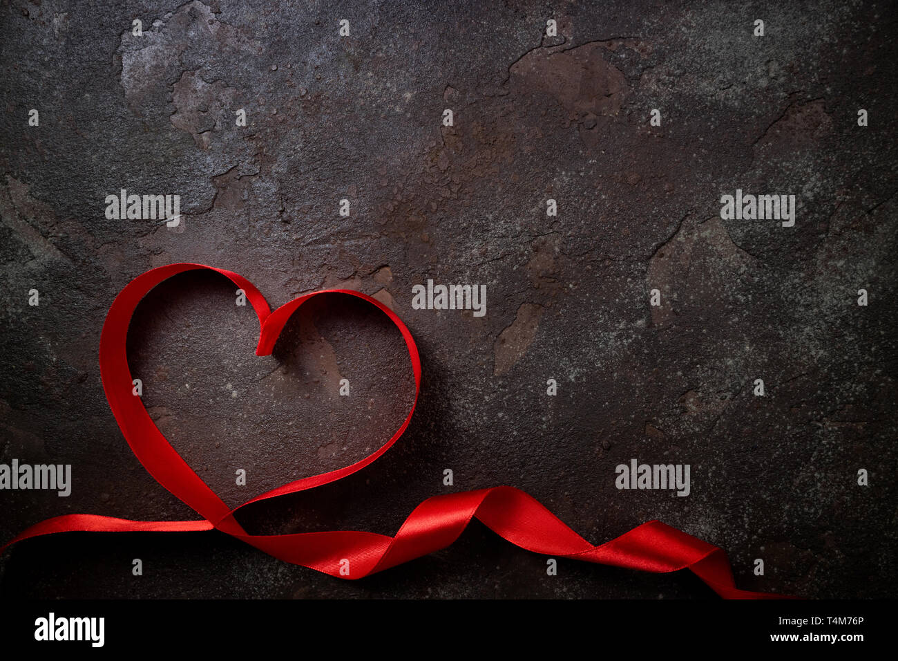 Valentines Day background with red heart. Heart shape from ribbons ...
