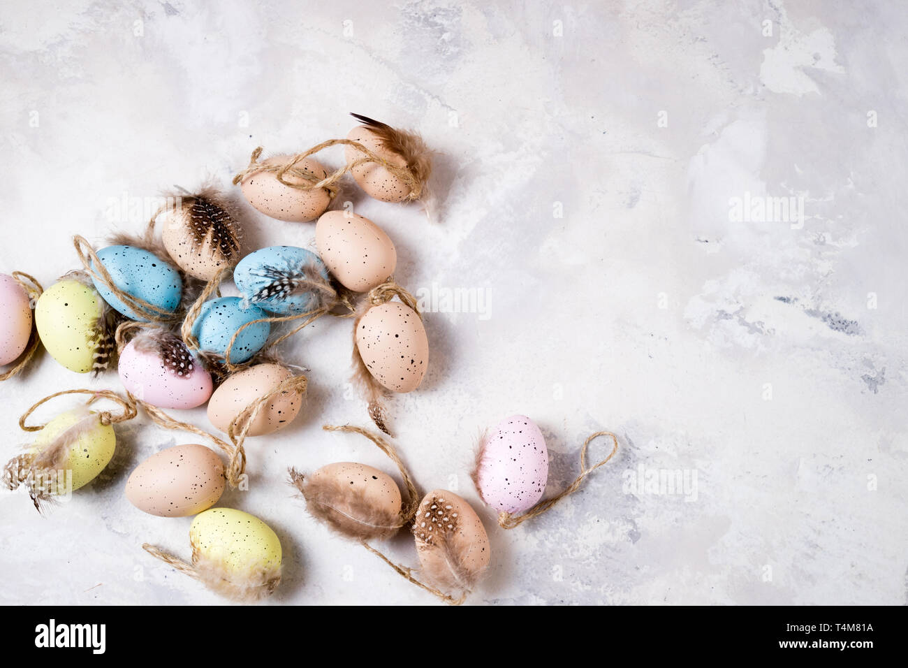 Decorative Easter eggs on stone background. Easter background. Top view, copy space Stock Photo