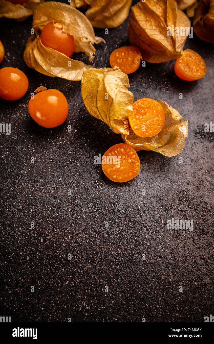 Cape Gooseberries on black background with copy space Stock Photo