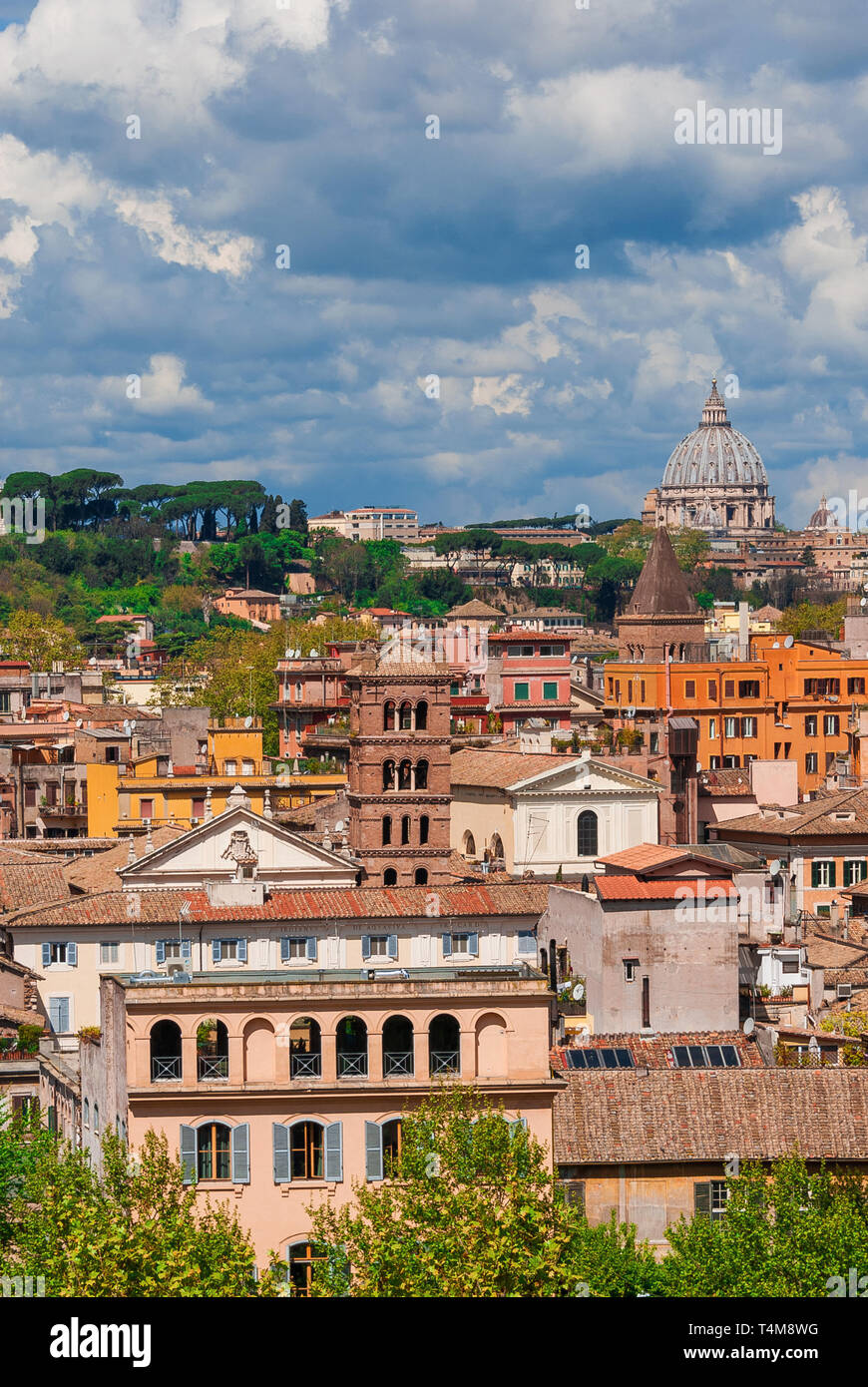 Rome historic center old skyline above Trastevere with old churches, belltowers, domes and clouds, seen from Aventine Hill Stock Photo