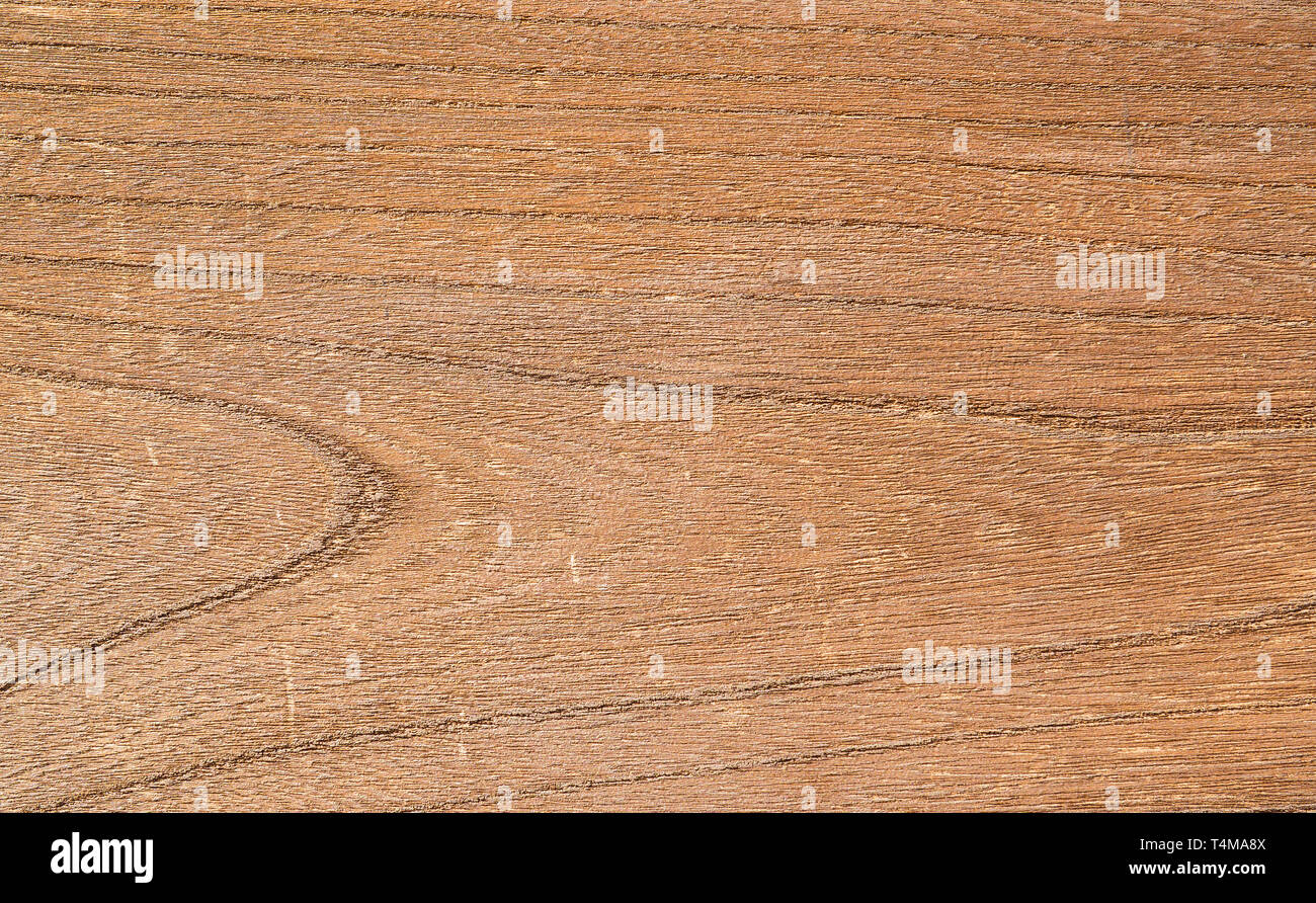 Old brown wooden plank with rough surface as background Stock Photo