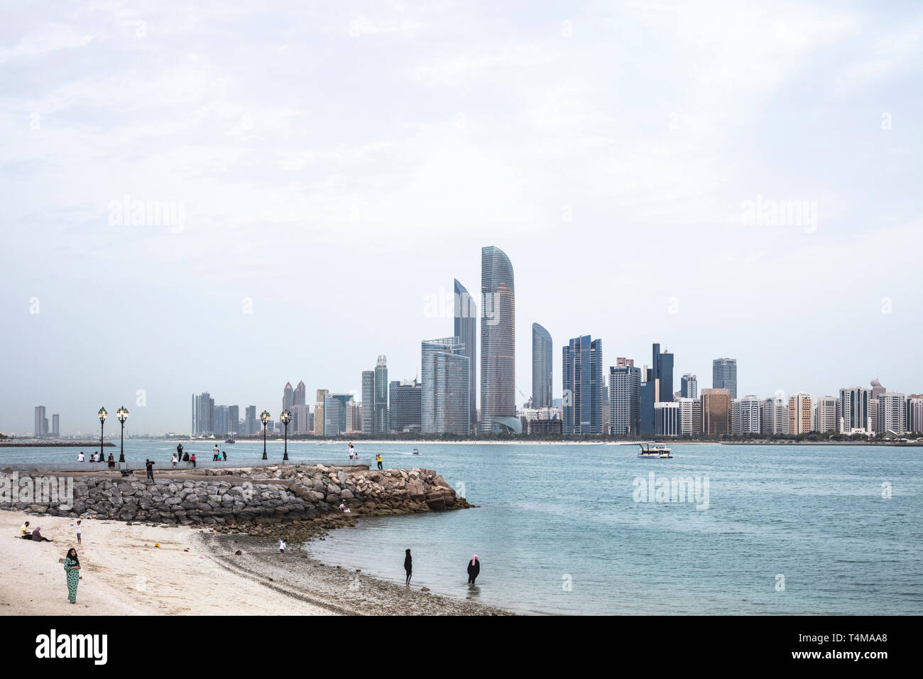ABU DHABI, UNITED ARAB EMIRATES - April 4, 2019: The city of Abu Dhabi at dusk seen across the Arabia Gulf.   ( Ryan Carter ) Stock Photo