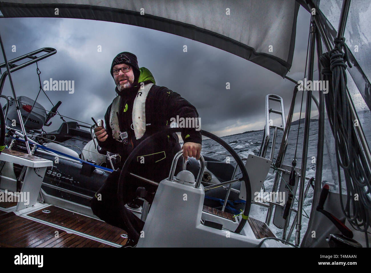 A Skipper At The Helm Of A Sailing Yacht In The Middle Of A Storm Arctic Circle Norway Stock Photo Alamy A Skipper At The Helm Of A Sailing Yacht In The Middle Of A Storm Arctic Circle Norway Stock Photo Alamy
