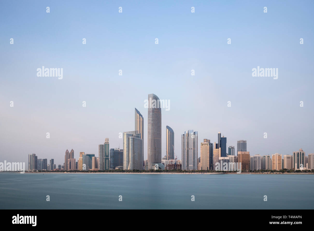 ABU DHABI, UNITED ARAB EMIRATES - April 6, 2019: The city of Abu Dhabi at dusk seen across the Arabia Gulf.   ( Ryan Carter ) Stock Photo