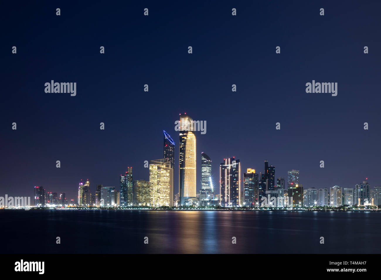ABU DHABI, UNITED ARAB EMIRATES - April 6, 2019: The city of Abu Dhabi at dusk seen across the Arabia Gulf.   ( Ryan Carter ) Stock Photo