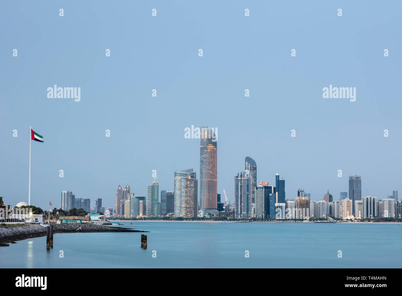 ABU DHABI, UNITED ARAB EMIRATES - April 7, 2019: The city of Abu Dhabi at dusk seen across the Arabia Gulf.   ( Ryan Carter ) Stock Photo
