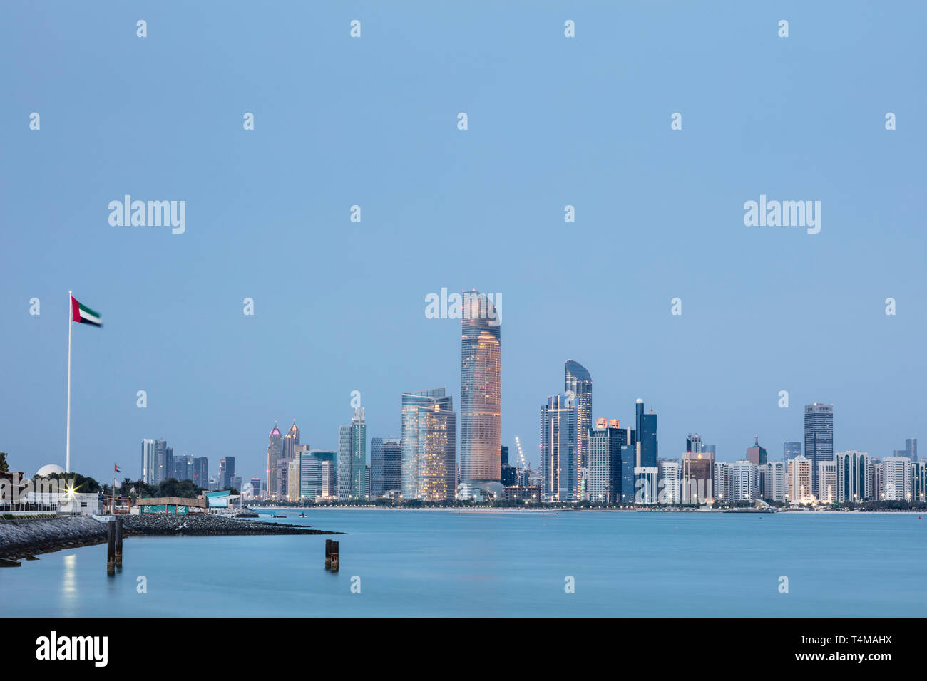 ABU DHABI, UNITED ARAB EMIRATES - April 7, 2019: The city of Abu Dhabi at dusk seen across the Arabia Gulf.   ( Ryan Carter ) Stock Photo