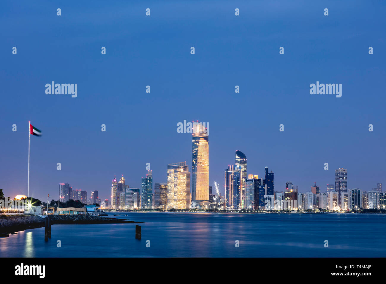 ABU DHABI, UNITED ARAB EMIRATES - April 7, 2019: The city of Abu Dhabi at dusk seen across the Arabia Gulf.   ( Ryan Carter ) Stock Photo