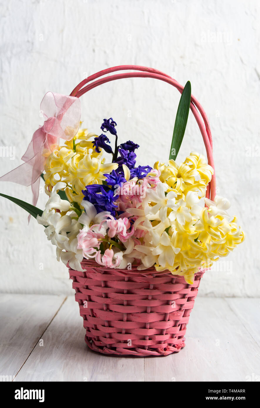 Decorated Easter eggs and hyacinth spring flowers in a basket Stock ...
