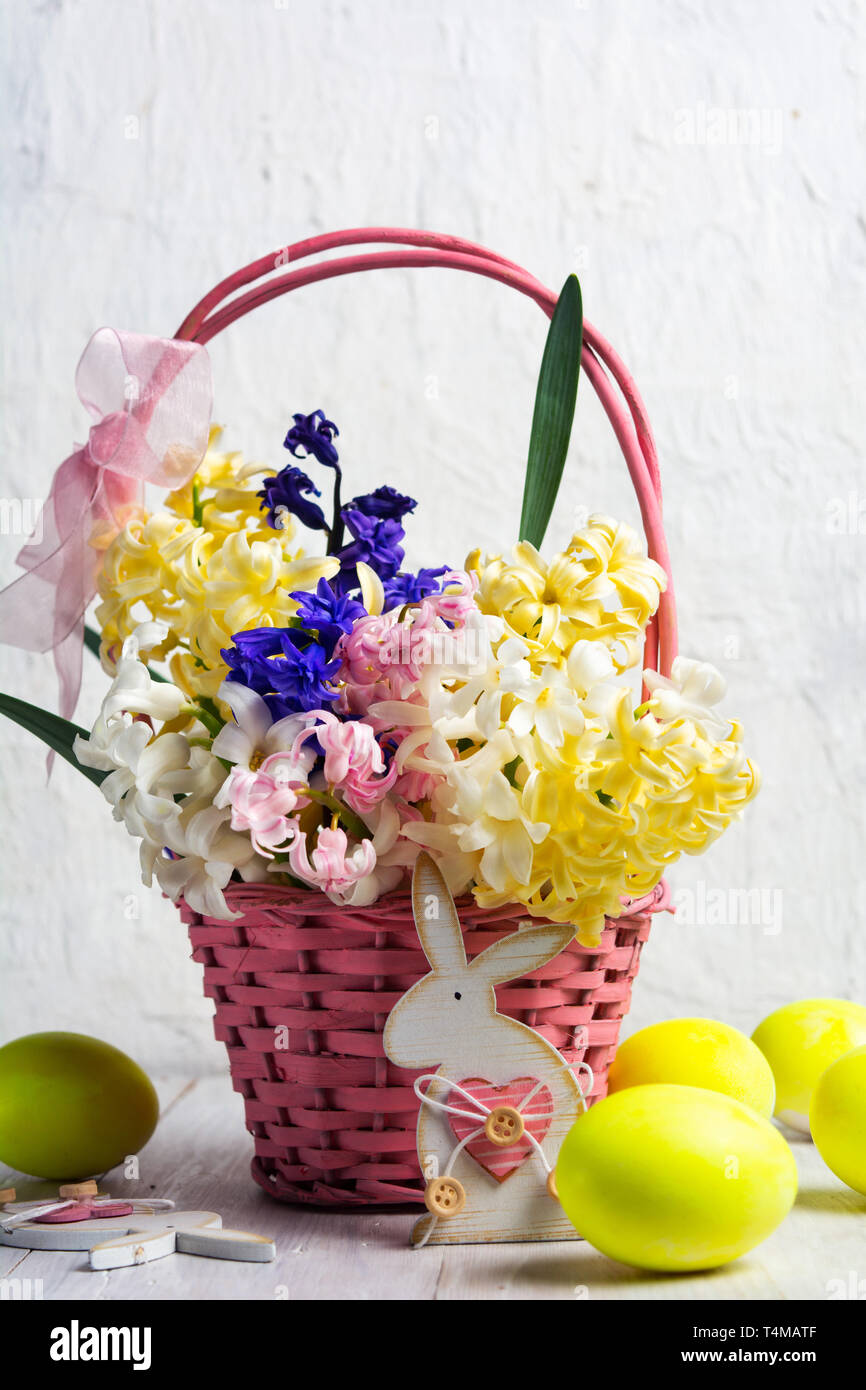 Decorated Easter eggs and hyacinth spring flowers in a basket Stock ...