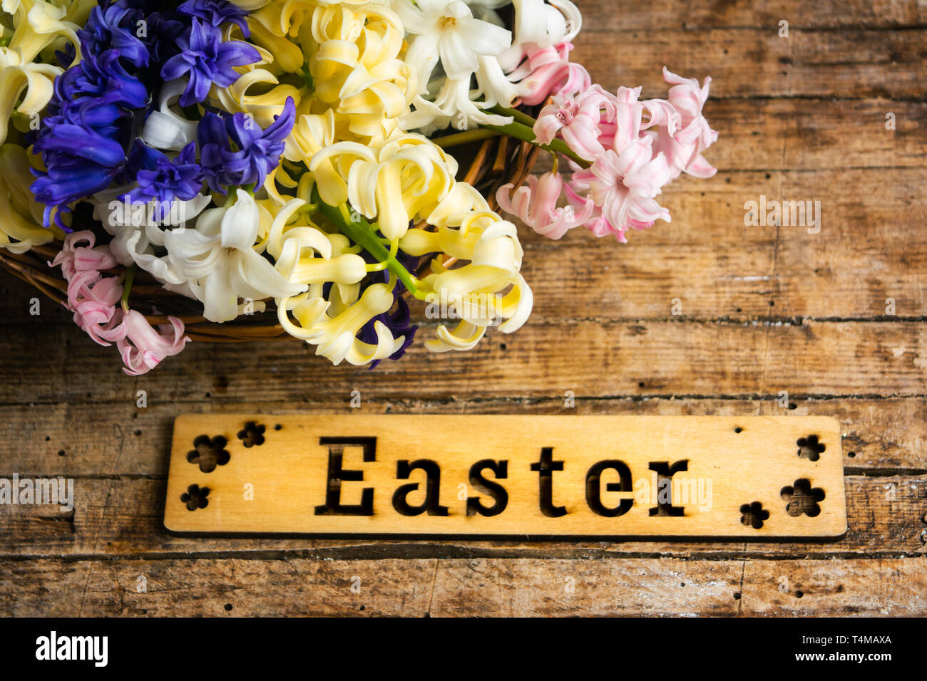 Eggs note card and colorful spring flowers Stock Photo