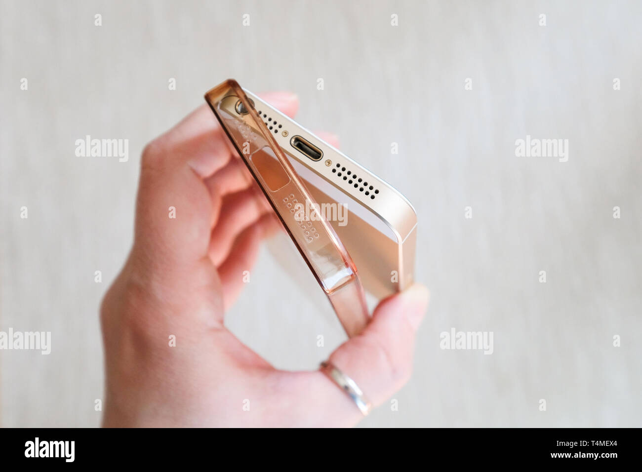 Silicone case for smartphone bent in his hand Stock Photo Alamy