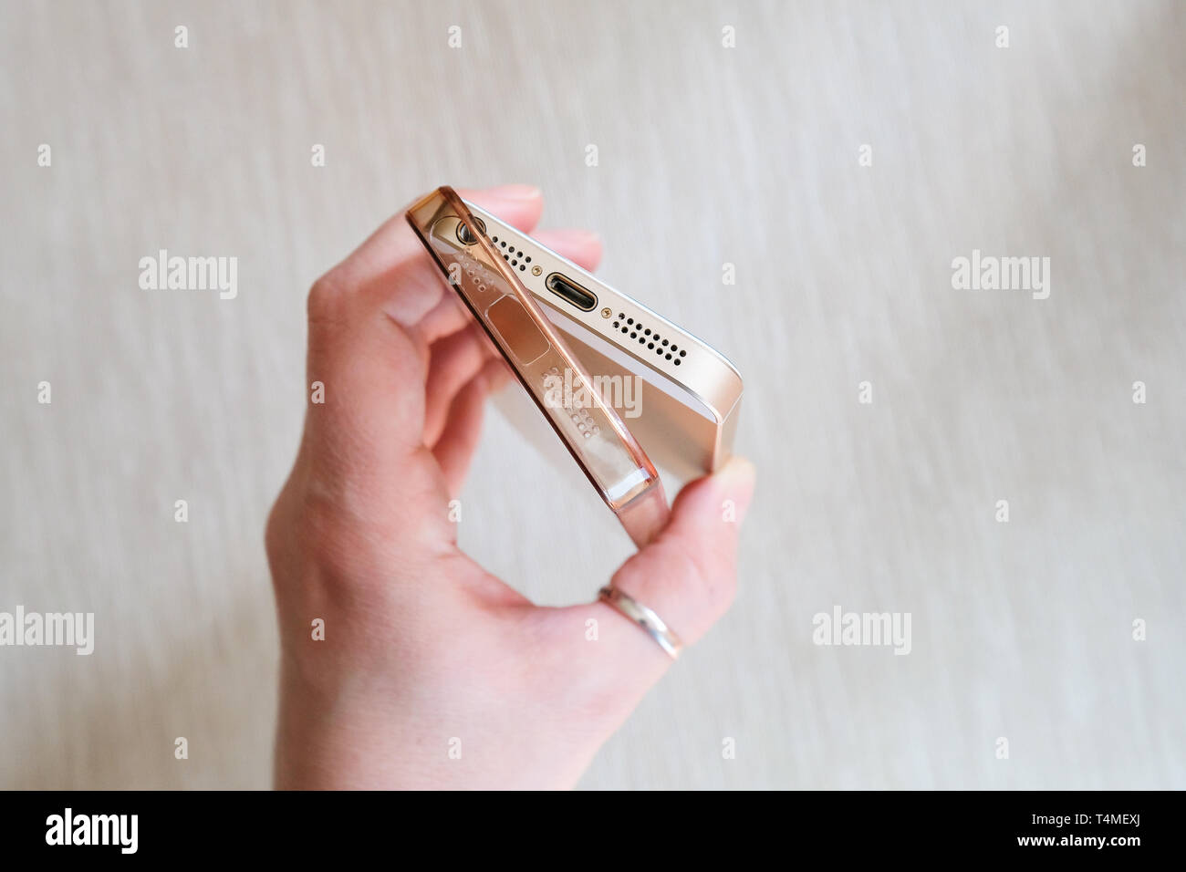 Silicone case for smartphone bent in his hand Stock Photo
