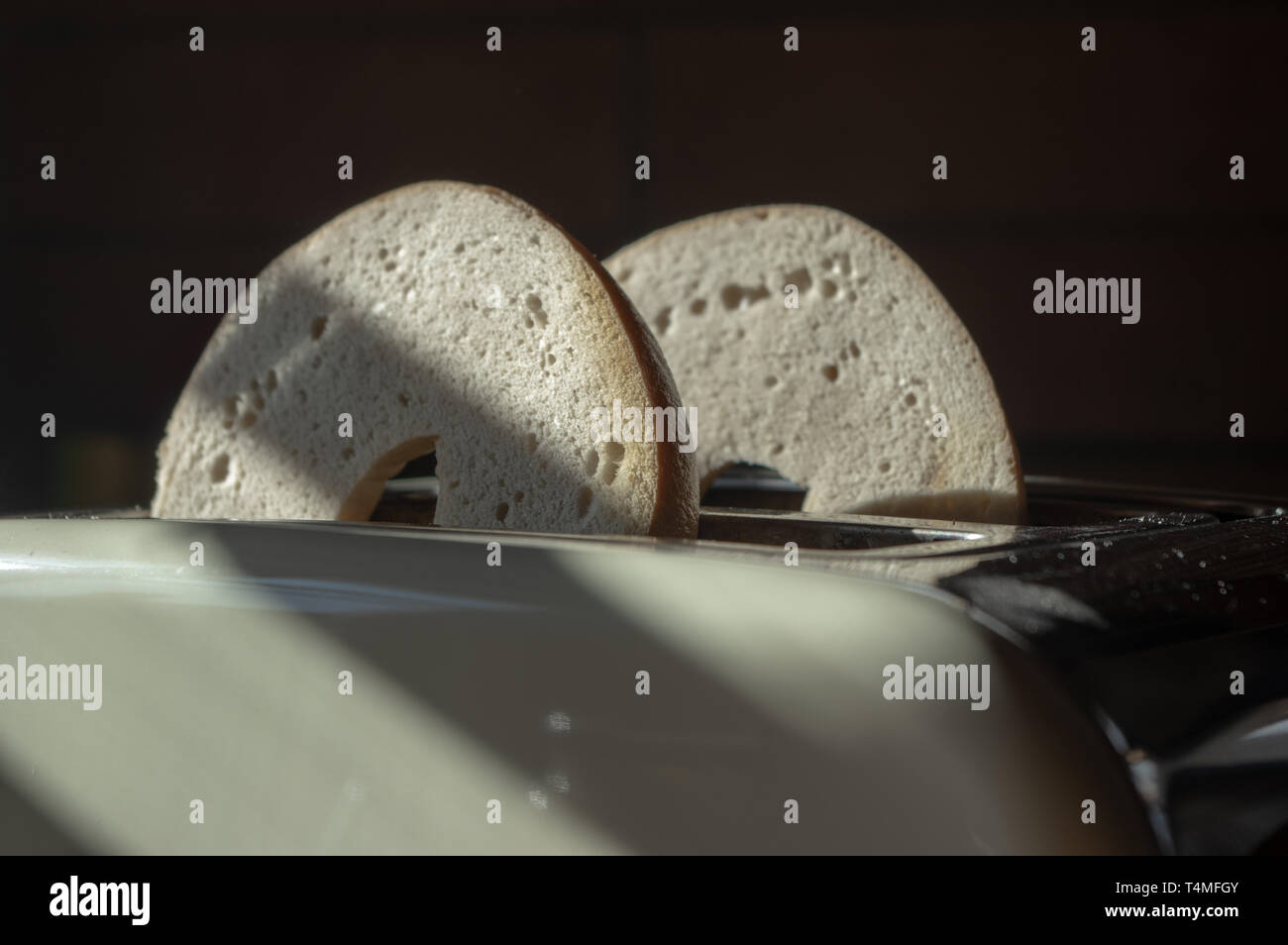 two bagel halfs in a toaster Stock Photo