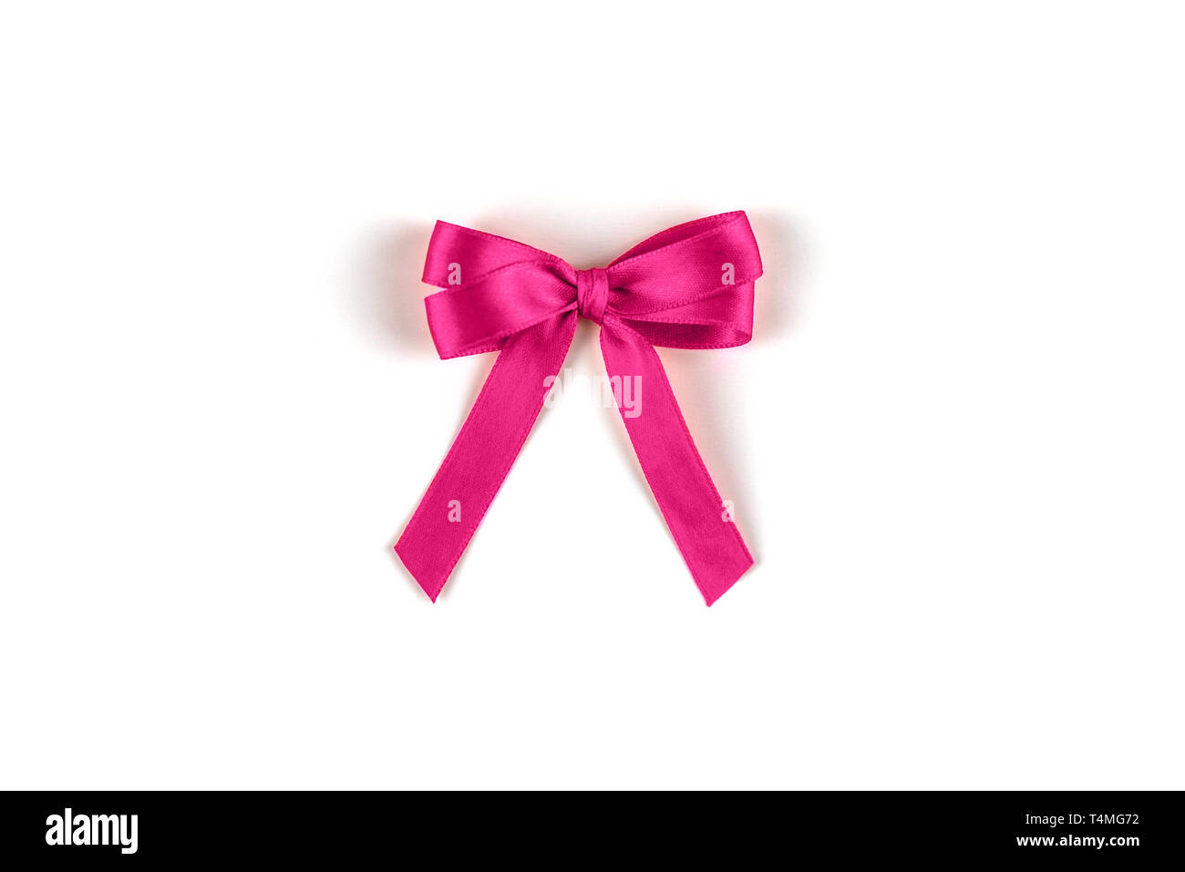 Shiny pink silk ribbon on white background. Stock Photo
