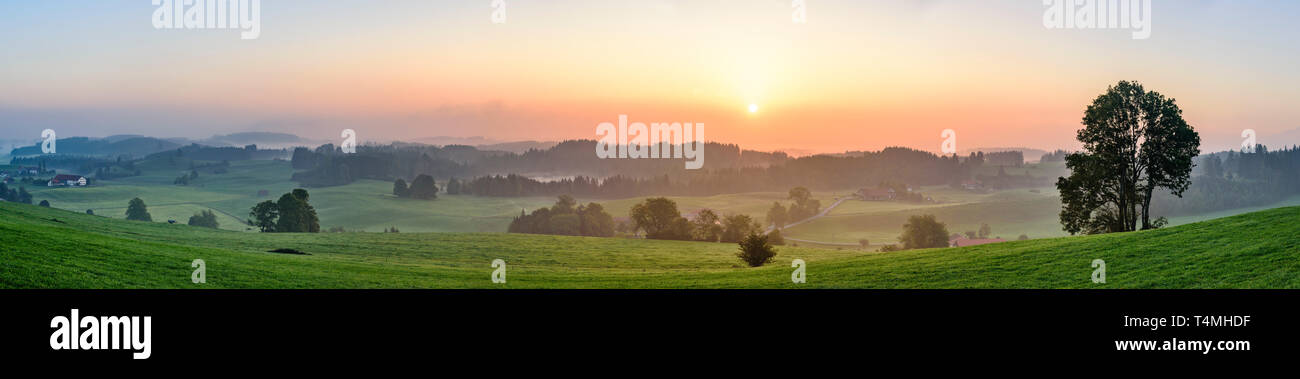 Morning dawn with fog in the Alpine foothills Stock Photo