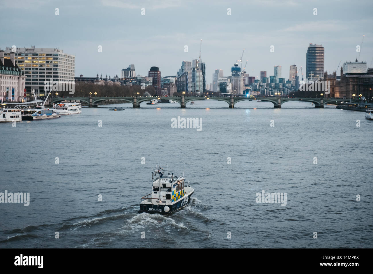 London, UK - April 13, 2019: Metropolitan Police Marine Policing Unit (MPU) on the River Thames, London on the background. MPU fleet is responsible fo Stock Photo