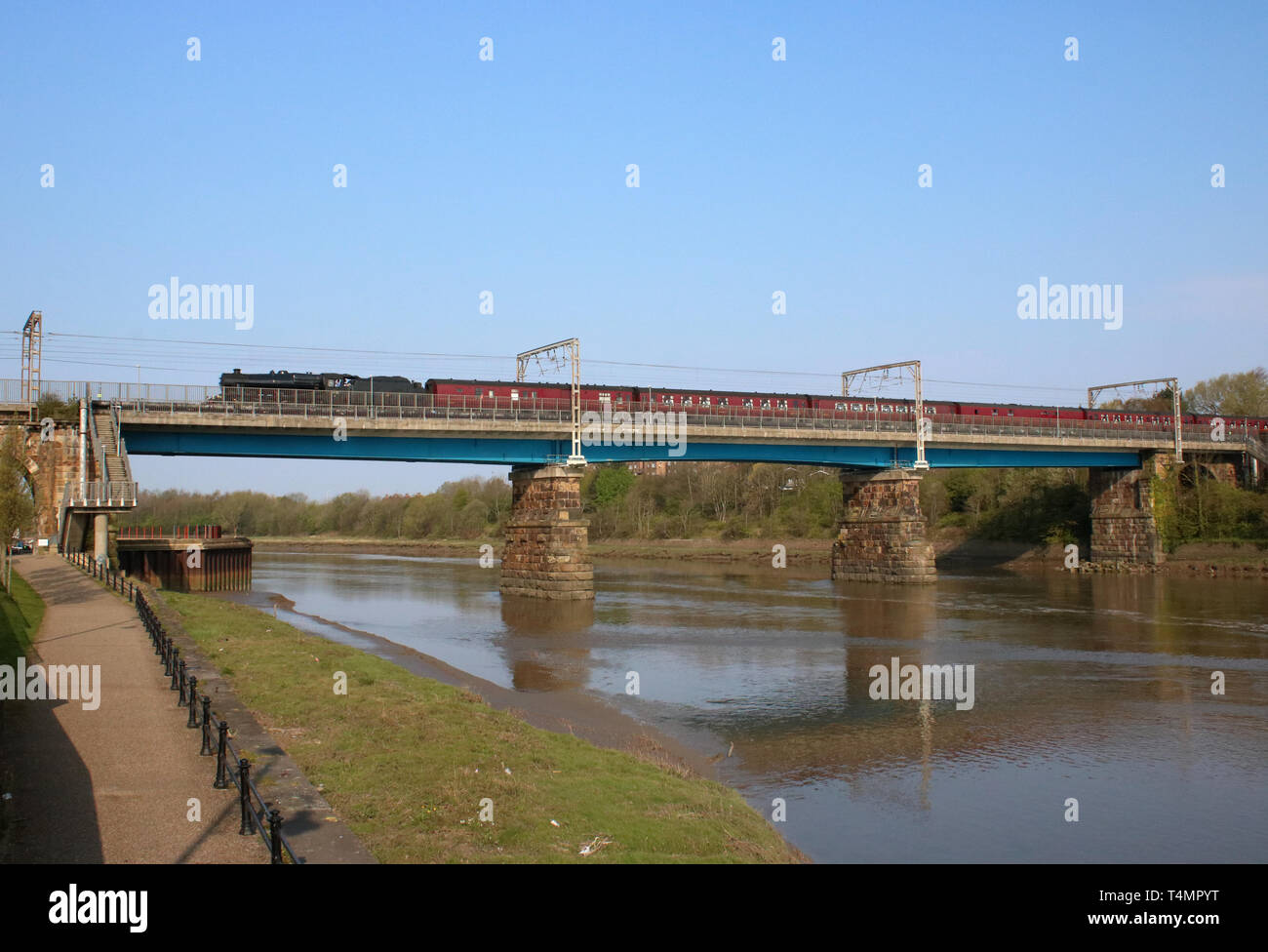 The Salopian Express steam hauled special train on West Coast Main Line, crossing Carlisle Bridge over the River Lune at Lancaster on 17th April 2019. Stock Photo