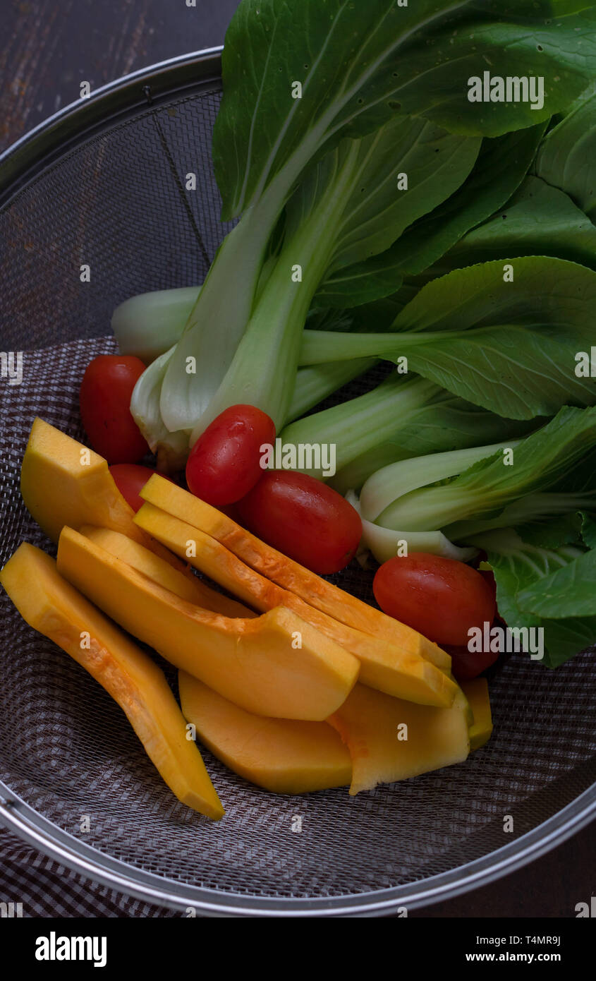 Vegetables in wire basket Stock Photo Alamy