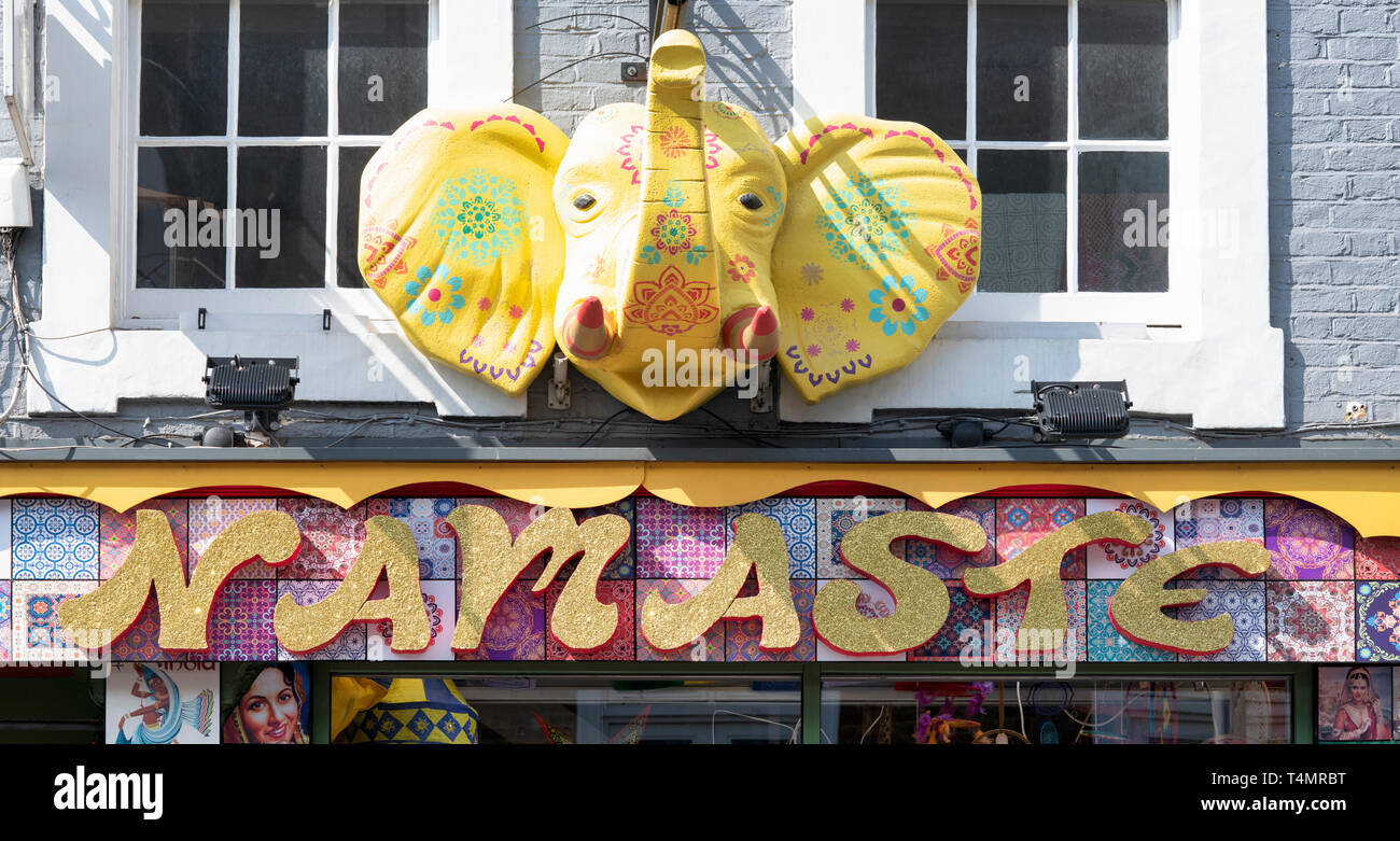 Colourful Indian elephant head sculpture above the Namaste shop. Pembridge Road. Notting Hill, West London. UK Stock Photo