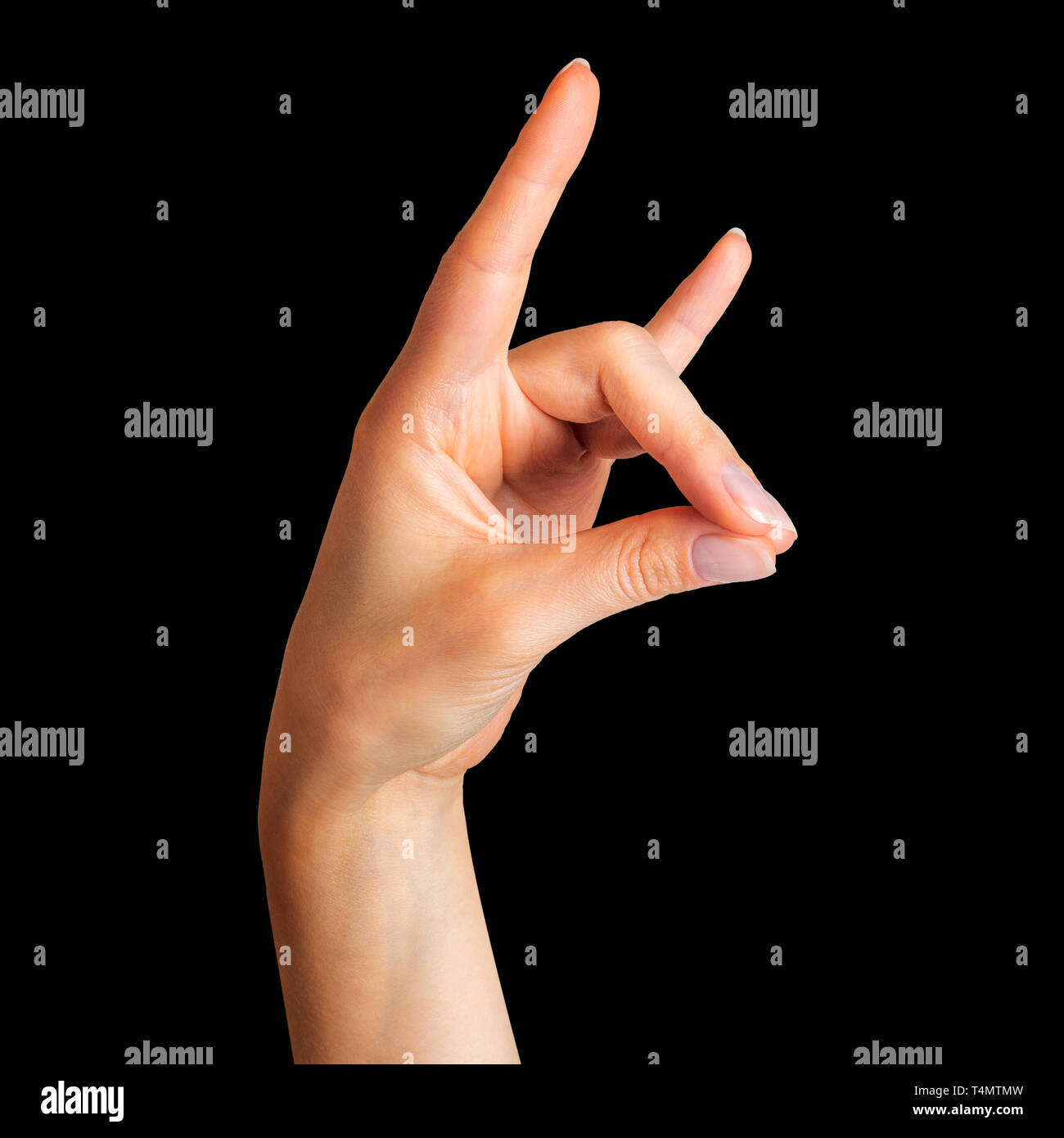 Female hand showing rock n roll sign or giving the devil horns gesture