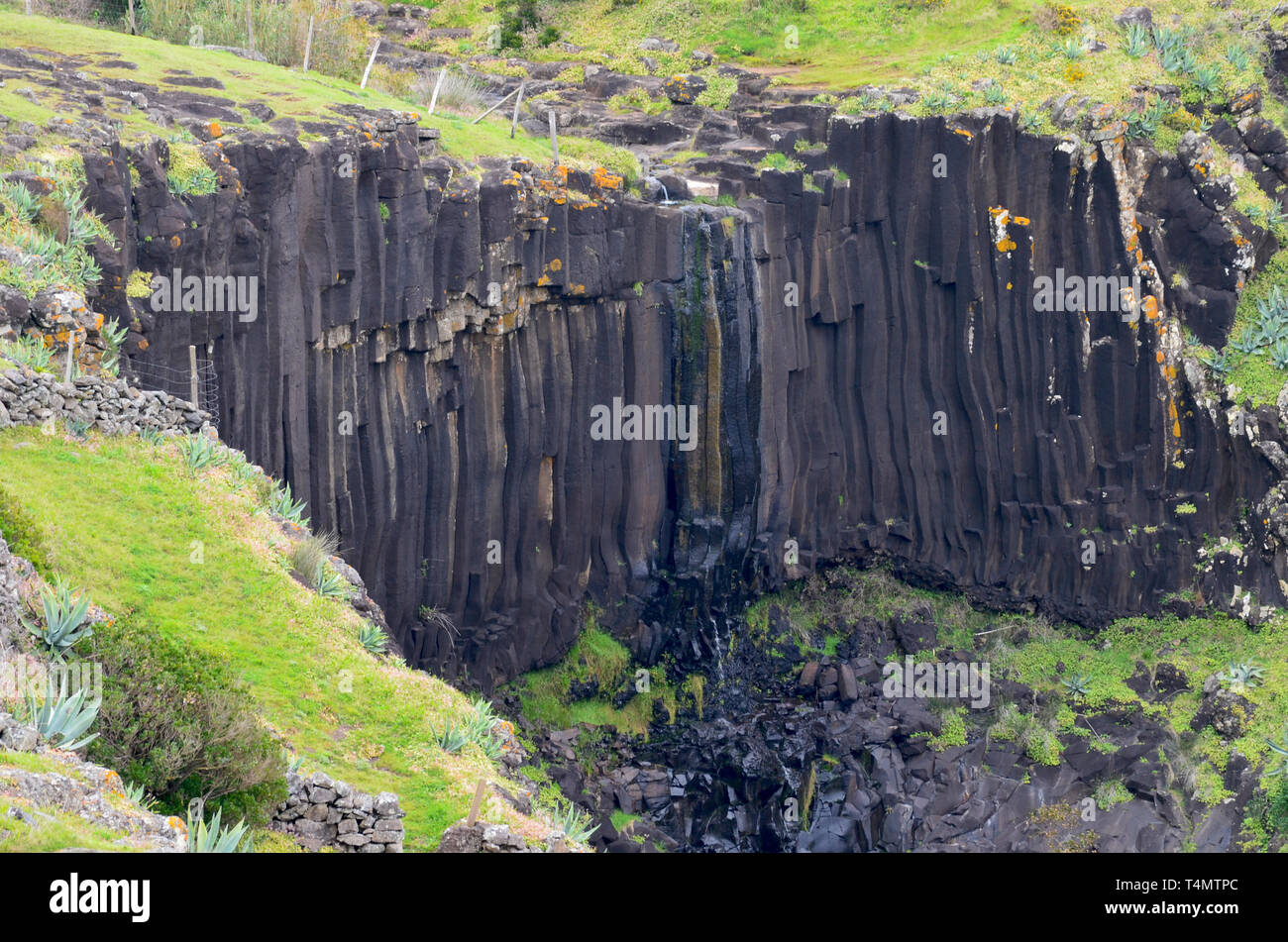 Basaltic columns in Santa Maria island, Azores: an outstanding natural area now threatened by the installation of a satellite-launching spaceport Stock Photo
