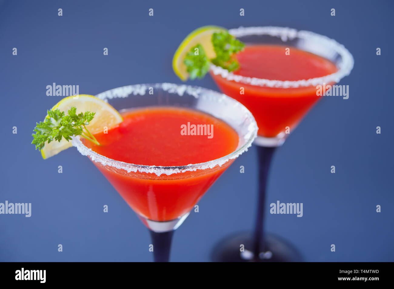 Bloody Mary Cocktail In Glasses With Lime Tomato Bloody Mary Spicy Drink On Blue Background Stock Photo Alamy
