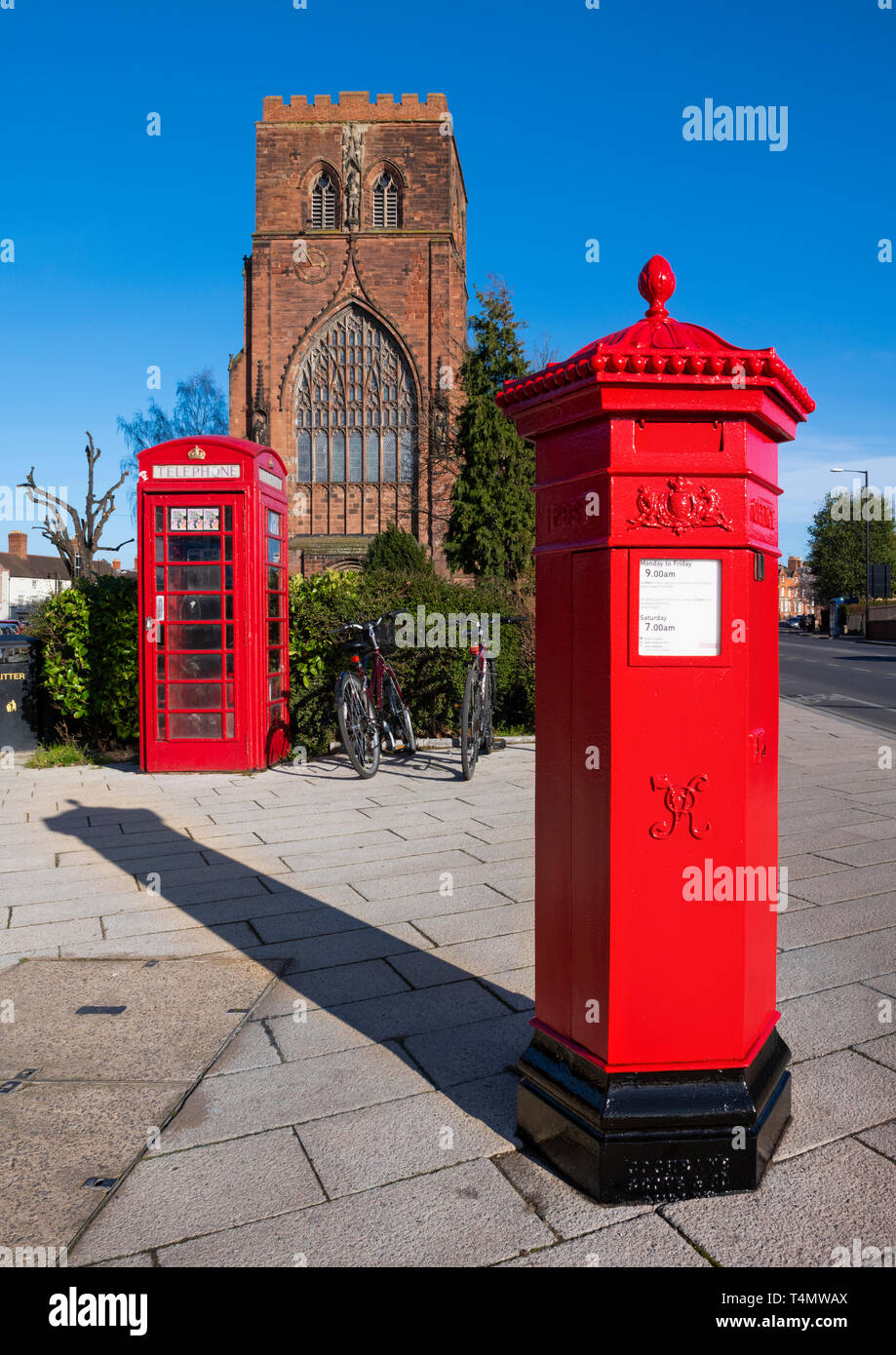Post box and phone box outside Shrewsbury Abbey, Shropshire, UK. Stock Photo