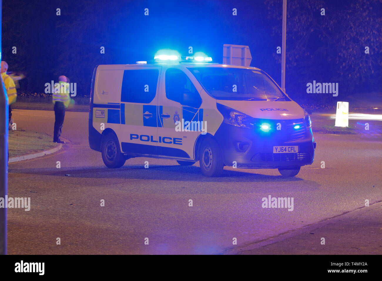 A police van used as a road block at the scene of a road traffic collision outside the Miller & Carter in Garforth, Leeds. Stock Photo