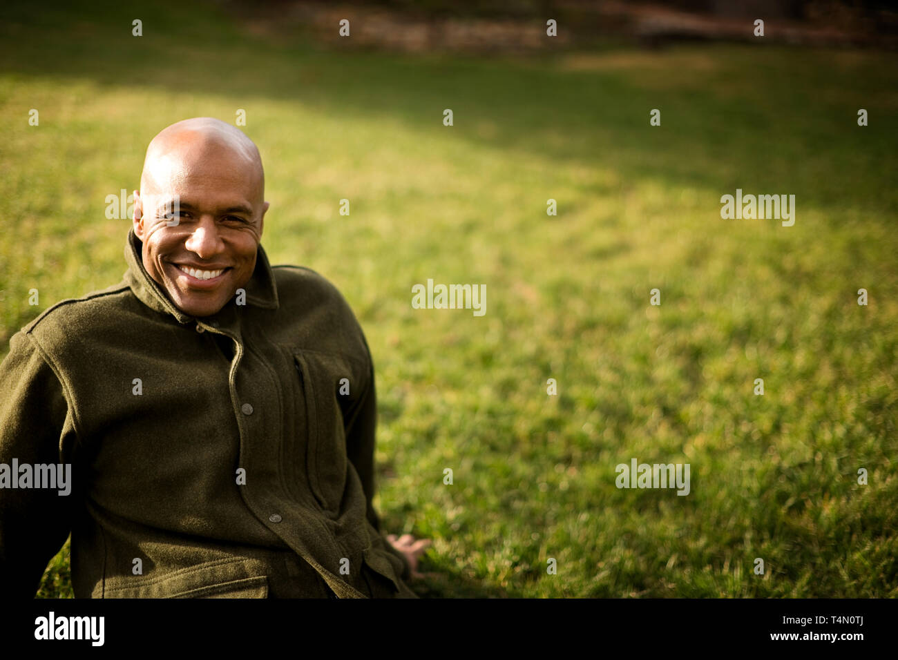 Smiling man relaxes outdoor hi-res stock photography and images - Alamy