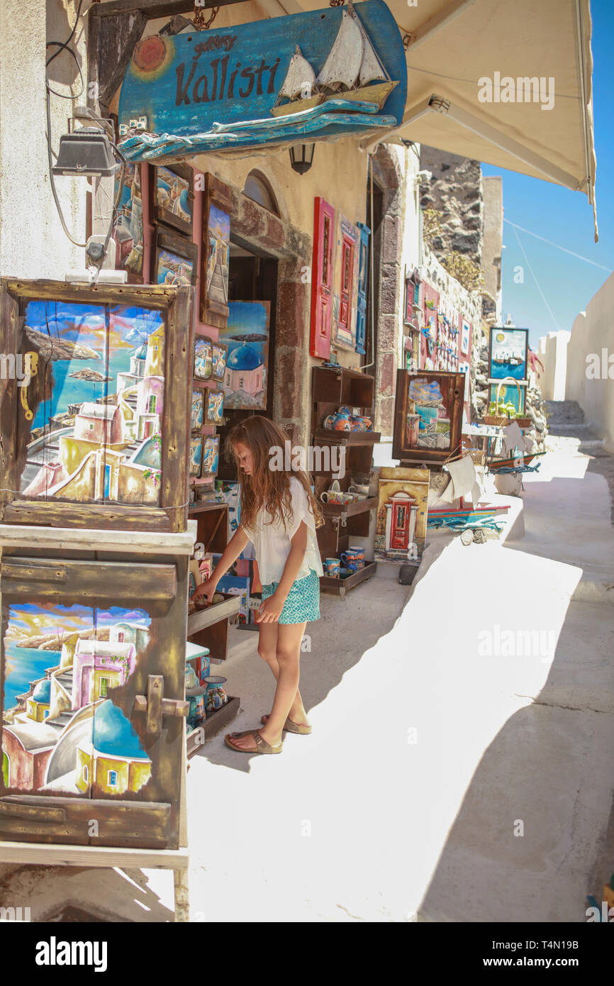 Young girl souvenir shopping in Oia, Santorini Stock Photo