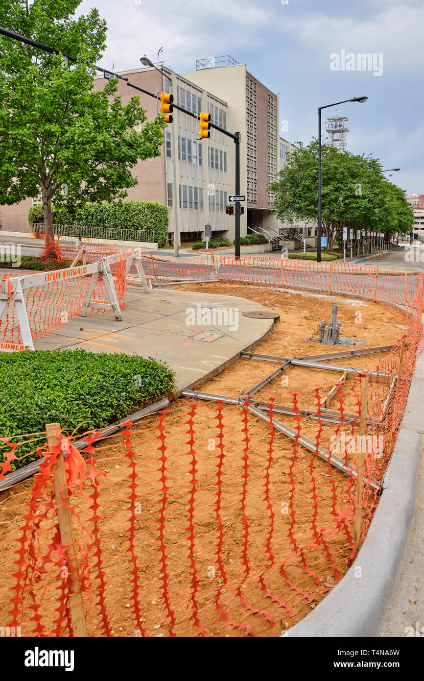 Concrete city sidewalk under construction for repair in Montgomery