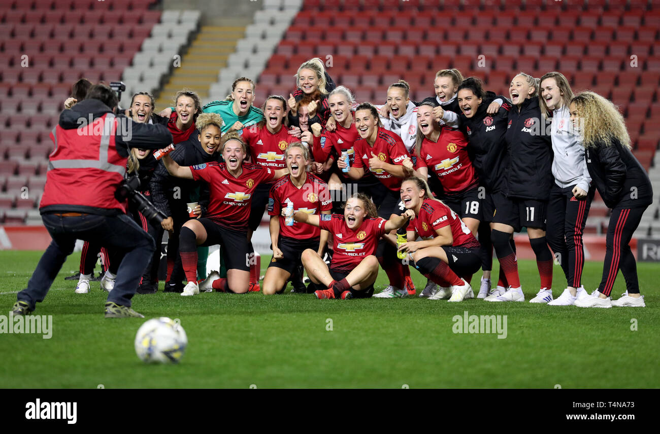 Manchester United Women pose for a photo after their win during the FA Women's Championship match at Leigh Sports Village. Stock Photo