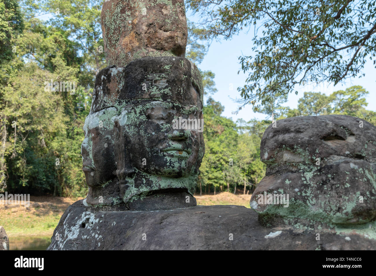 Carved human face at UNESCO World Heritage archeological site of Preah Khan in Cambodia Stock Photo