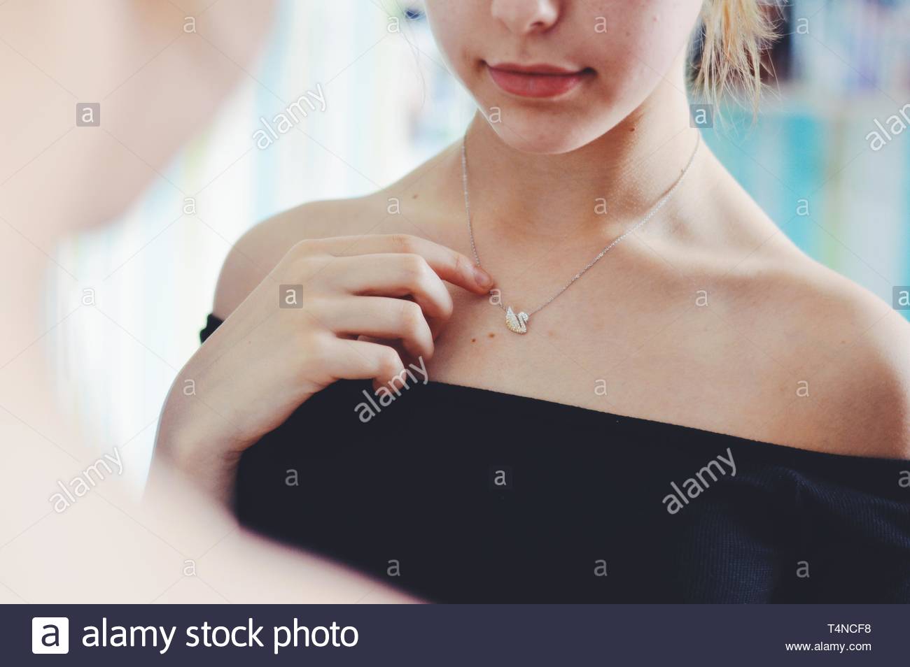Woman Necklace Holding Stock Photos & Woman Necklace Holding Stock Images Alamy