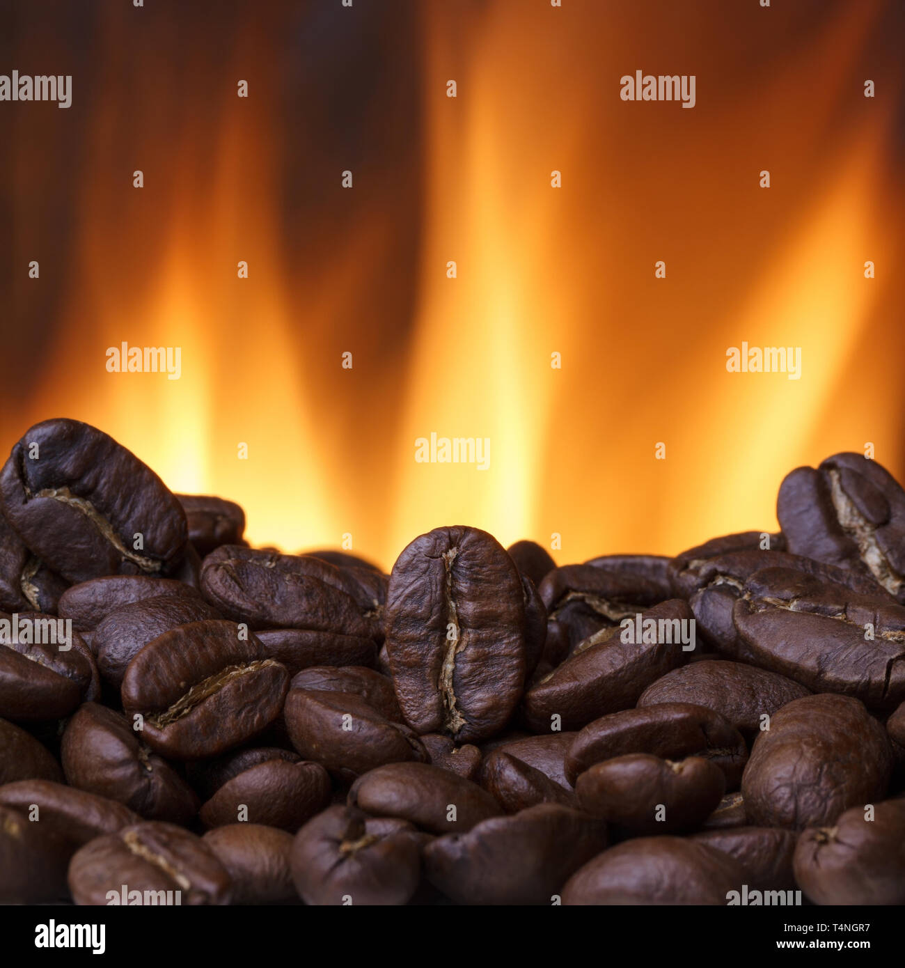 Coffee beans roasting with fire on background Stock Photo Alamy