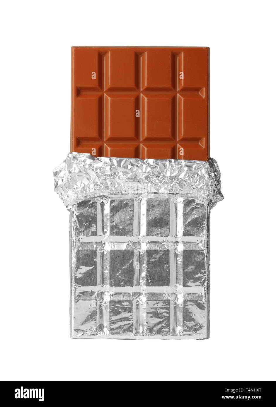 Milk chocolate bar in silver foil, half opened, isolated on white Stock