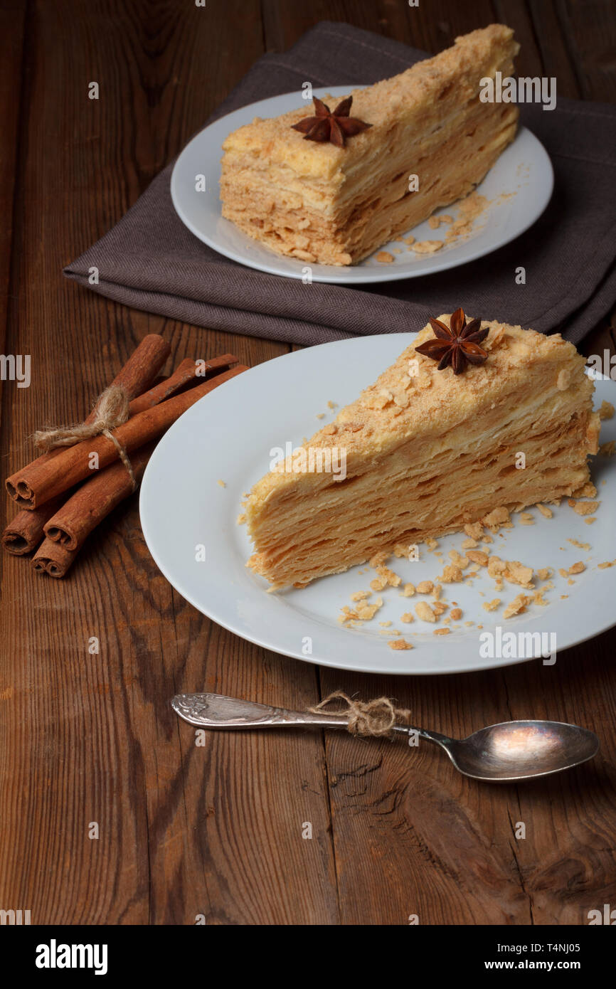 Slice of layer cake with anise and cinnamon Stock Photo