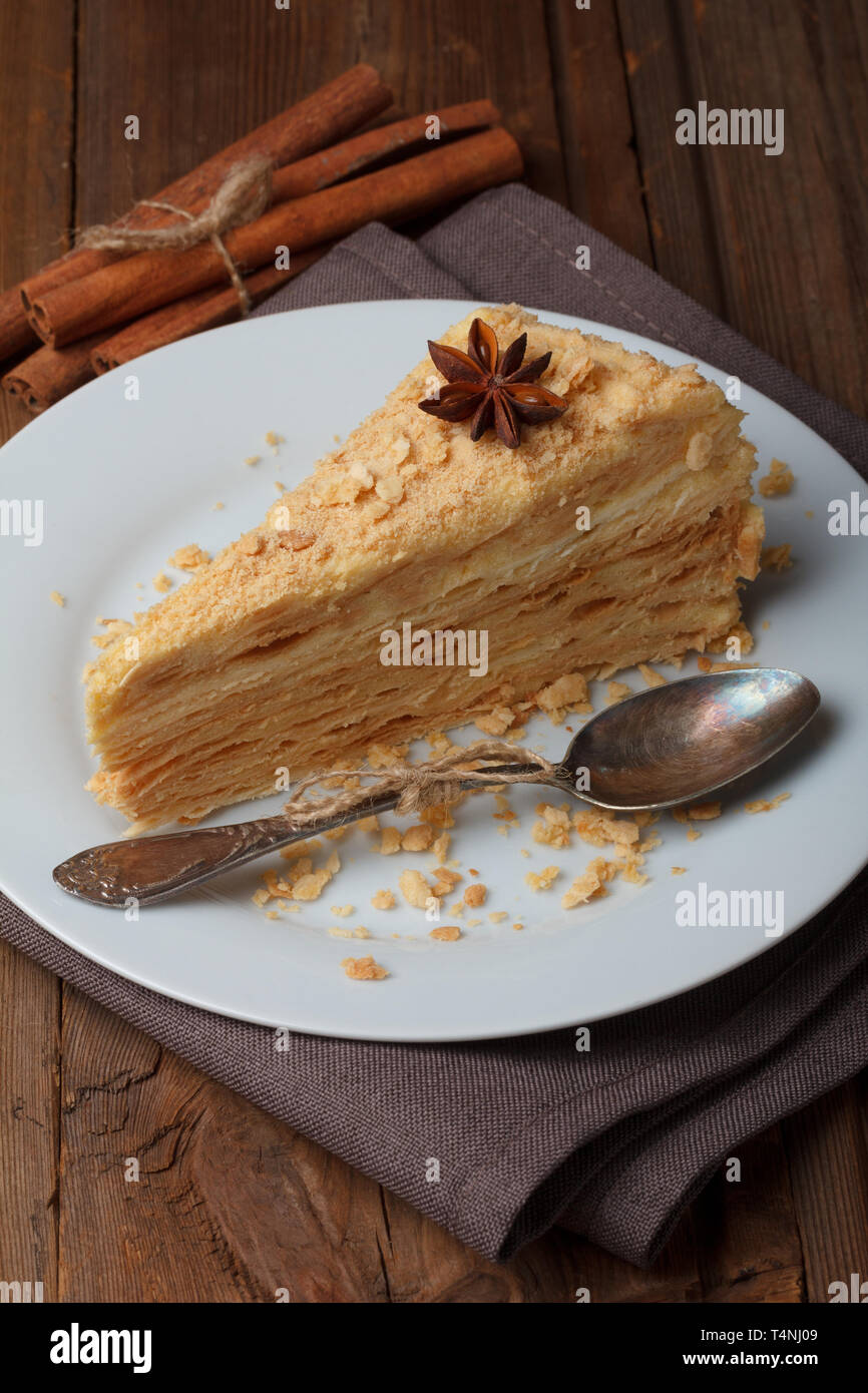 Slice of layer cake with anise and cinnamon Stock Photo